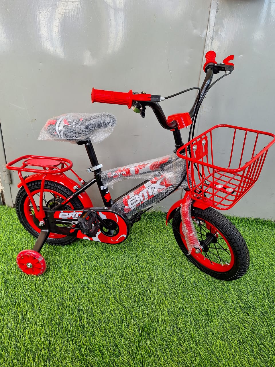 size 12 BMX kids bike with carrier & front basket + side balancing wheels with lights