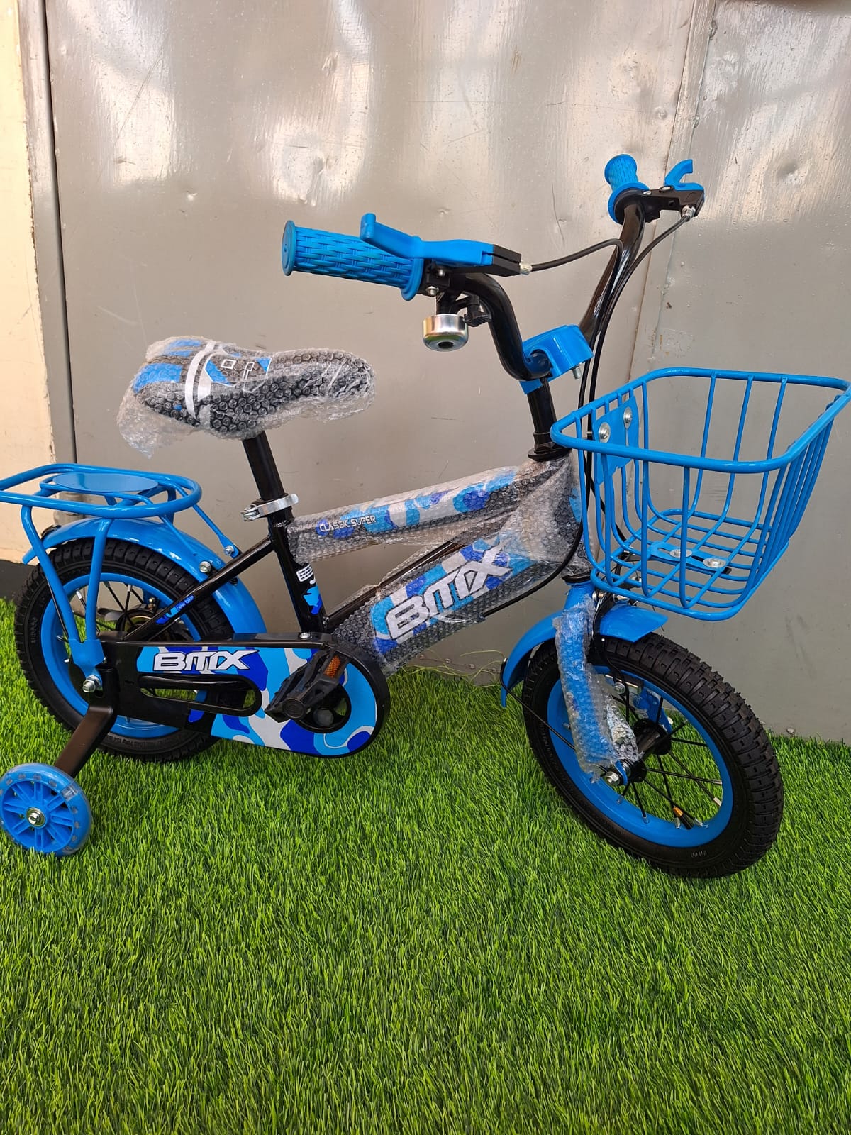 size 12 BMX kids bike with carrier & front basket + side balancing wheels with lights